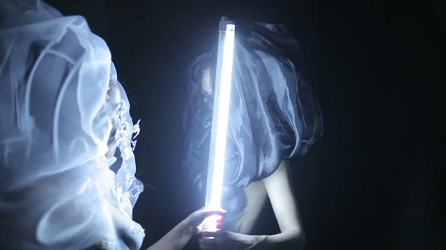 Two Body Art Models Beside The Lamp