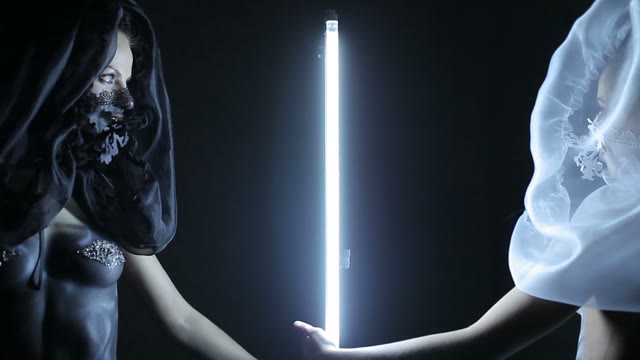 Two Body Art Models Beside The Lamp