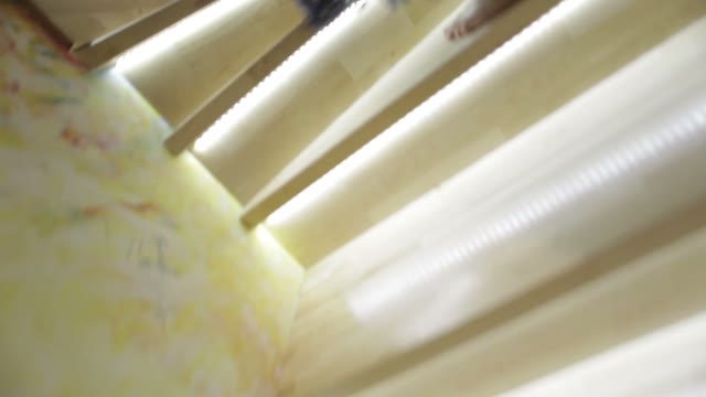 Woman In A Dress Is Going Up The Stairs. Close-up Of Feet.