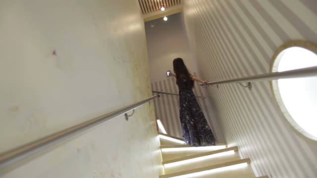 Woman Posing On The Stairs And Makes Selfie