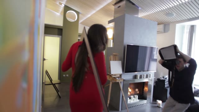 Photographer Takes Pictures Of A Girl Posing In A Picture Frame