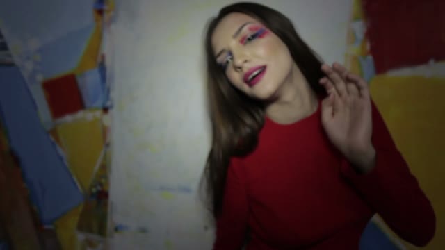 Girl Holding The Camera And Posing