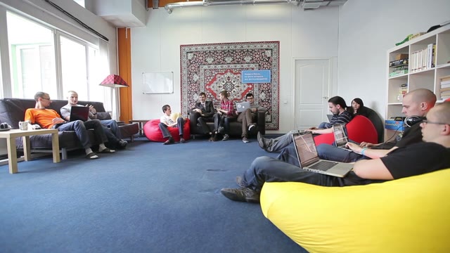 Smiling Creative Team With Laptop Computers