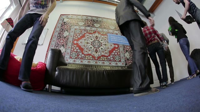 Programmers With Laptops Coming Out Of The Room. Bottom View