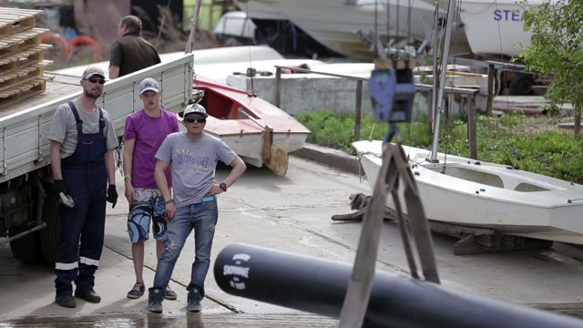 Three Men On The Bank Discuss