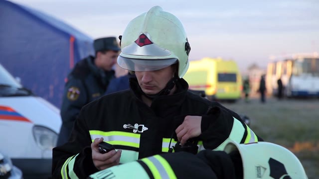 Firefighter Checks Radio