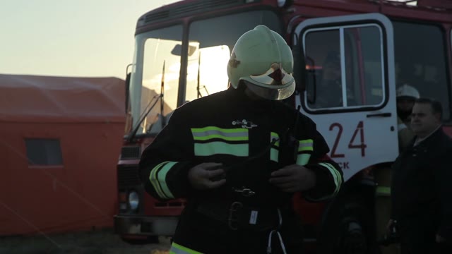 Firefighter Checks Radio