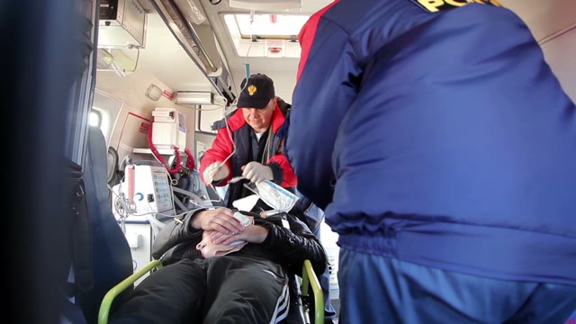 Medics At Work In The Ambulance