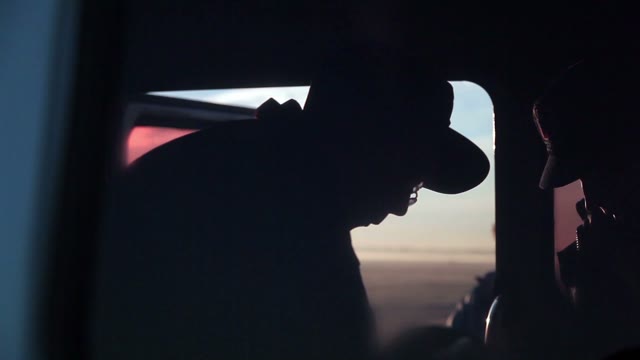 Silhouettes Of People In The Car