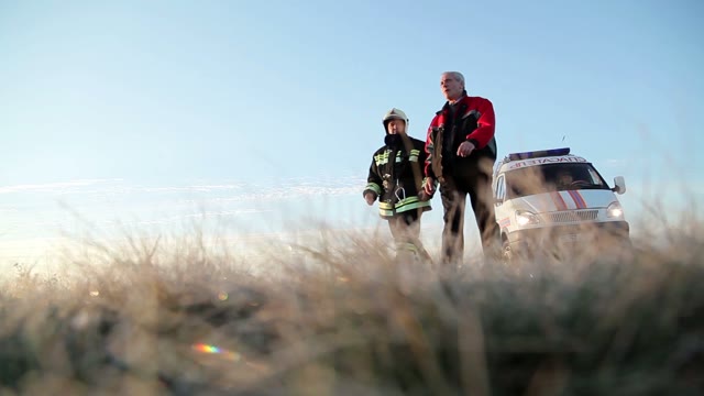 Rescuers Go On The Field. Ambulance