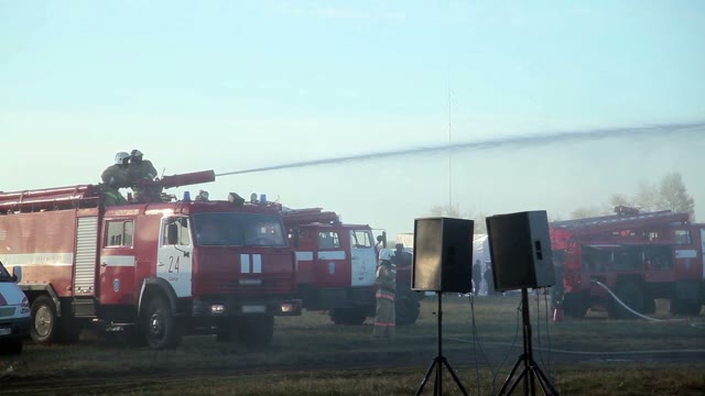 Firemen Using Water Cannon To Fight Fire