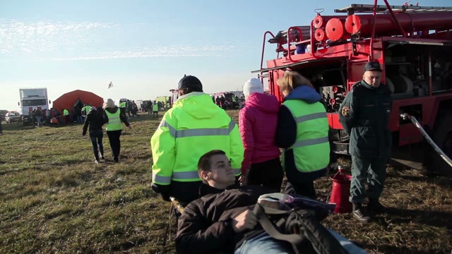 Men Carry On A Stretcher