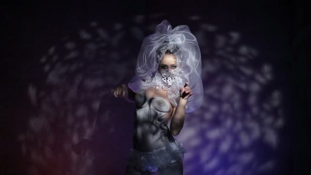 Body Art Model In White Dancing