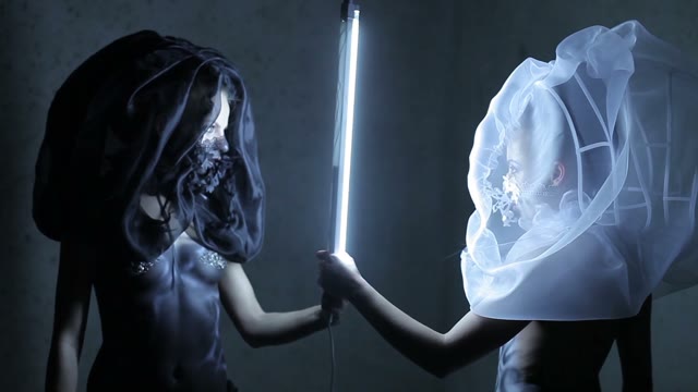 Two Body Art Models Beside The Lamp