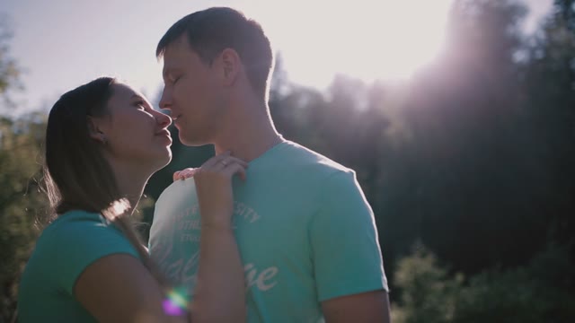 Young Couple Embracing In Nature