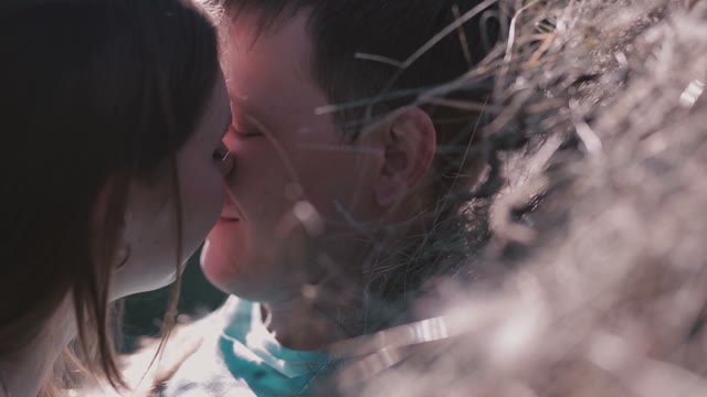 Happy Couple Kissing In Nature
