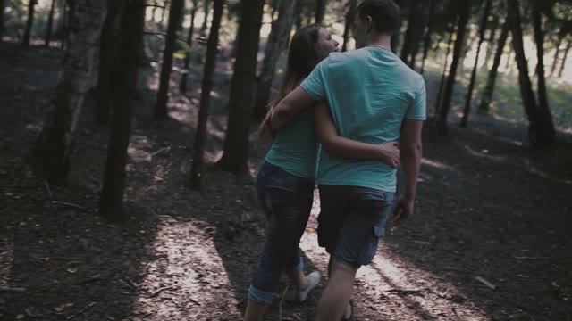 The Couple Goes Through The Woods And Hugs