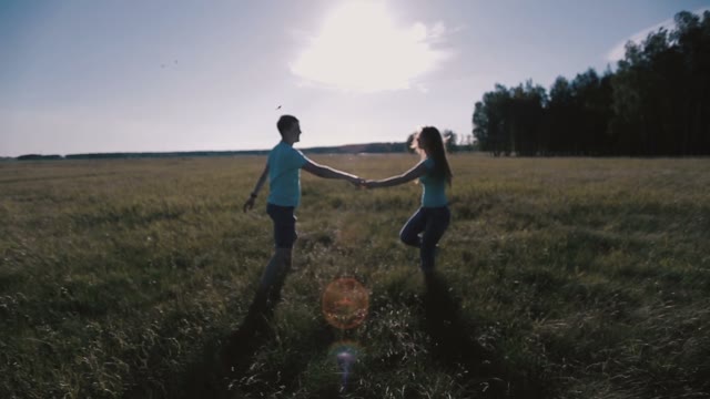 Happy Couple Holding Hands And Running