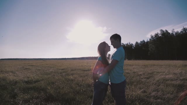 Beautiful Couple Hugging In The Meadow