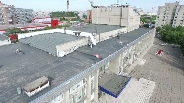 Shooting Of The Building And The City With Soaring Quadrocopters