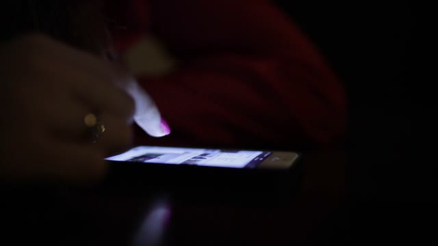 Smartphone On The Table. Close Up Of A Finger Using The Phone