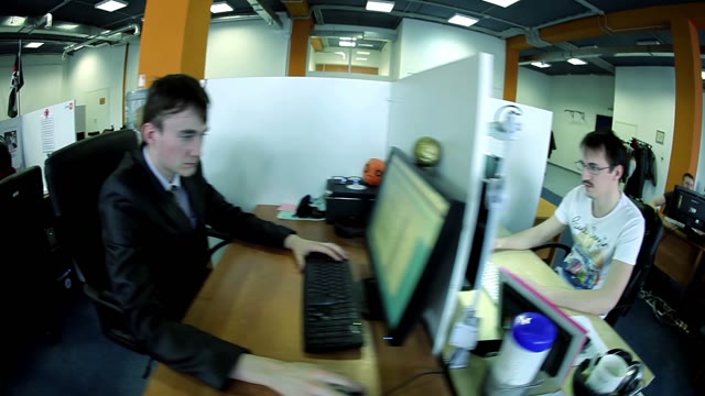 Young People Working At Computers In The Workplace