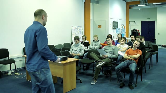 Man Talking With A Small Group Of Students In A Audience