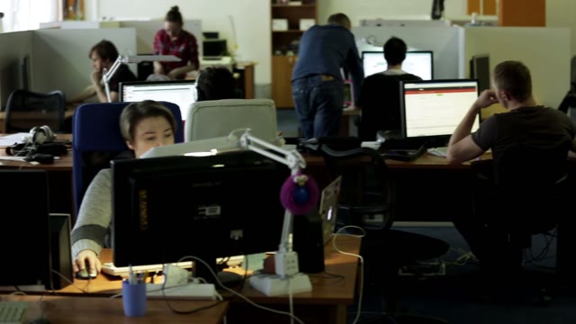 Programmers Working On The Computer In The Workplace