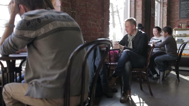 People Relax In A Coffee Shop