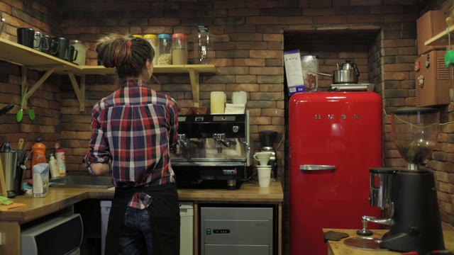 A Young Pretty Girl In A Small Kitchen Preparing Food