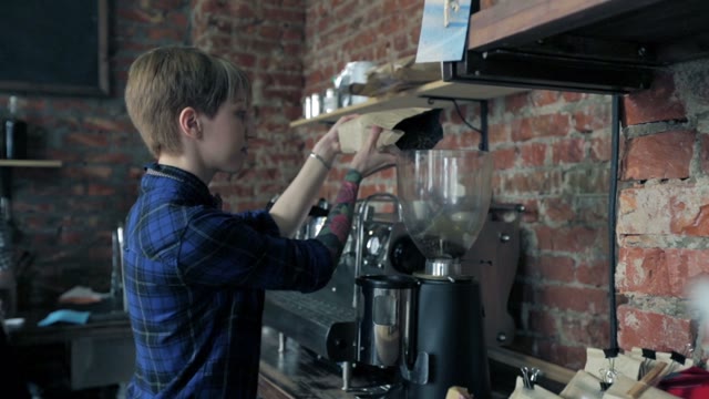 Cute Girl Barista Added Coffee Beans In Coffee Grinder