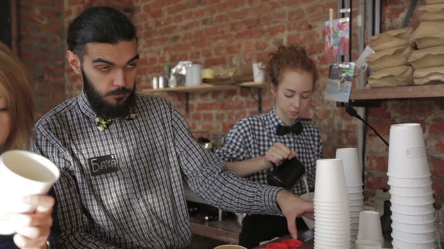 The Staff Caters To Visitors In The Cafe