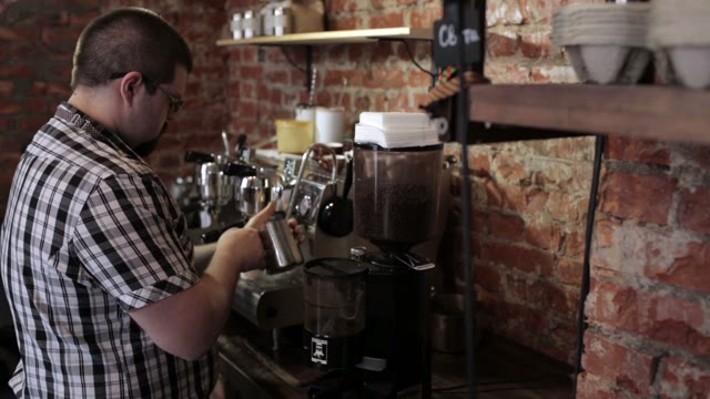 The Guy Barista With A Beard And Glasses Whips Milk