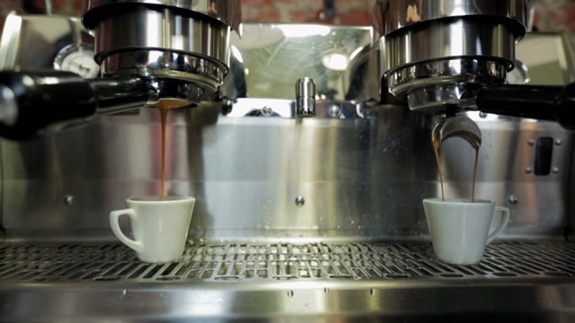 Coffee Machine Pouring Coffee In Small Cups