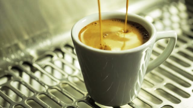 Coffee Machine Pouring Coffee In Small Cup