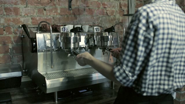 Barista Prepares Espresso Machine Before Preparing Coffee