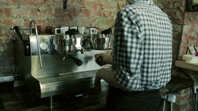 Barista Prepares Espresso Machine Before Preparing Coffee