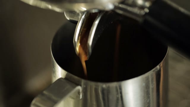 Preparing Cups Of Espresso At A Busy Coffee Shop