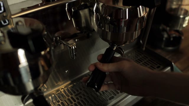 Barista Prepares Espresso Machine Before Preparing Coffee