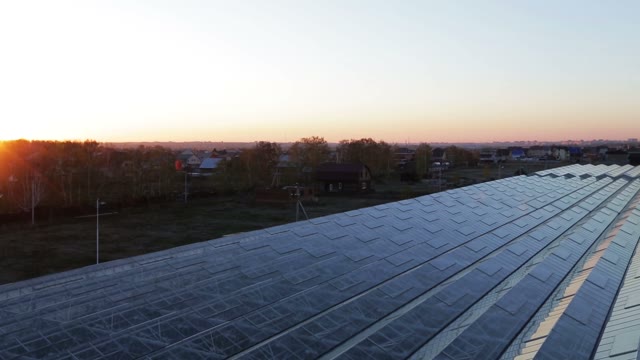 Panorama Roof A Huge Greenhouse. Reflection Of The Sun's Rays At The Corners Of