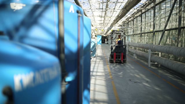 Empty Forklift Rides To On Camera In The Corridor