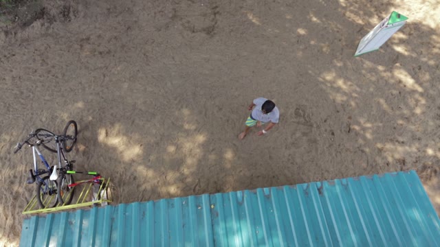 Youth Takes The Sports Equipment On The Beach, Overhead View.