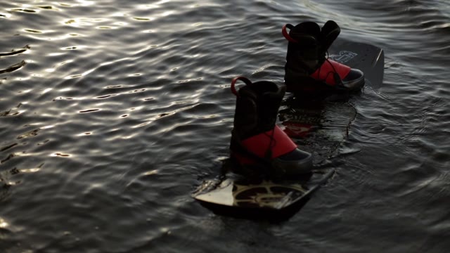 Wakeboard Floating On The Water. Wonderful Highlights!
