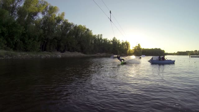 Young Boy Doing Tricks On A Wakeboard. Slow Motion.