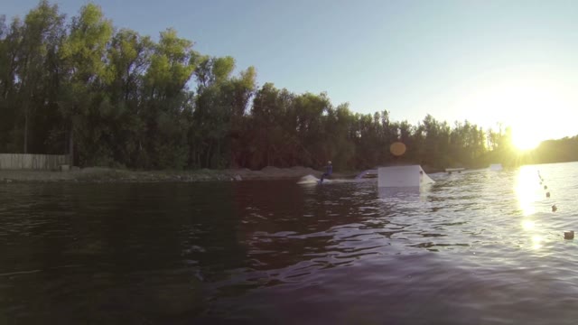 Young Boy Doing Tricks On A Wakeboard. Slow Motion.