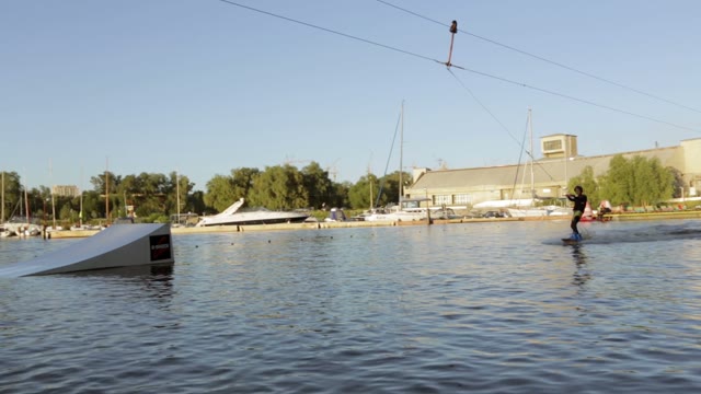 A Man Riding A Wakeboard.