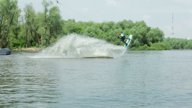 Young Man Doing A Difficult Trick In The Wakeboard