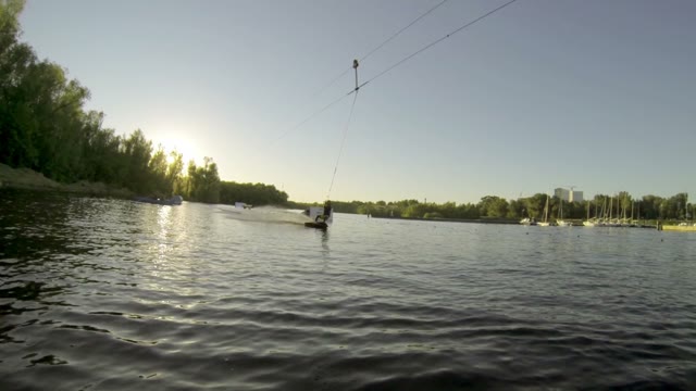 Man Does Extreme Stunts On A Wakeboard In Slow Motion On The Lake