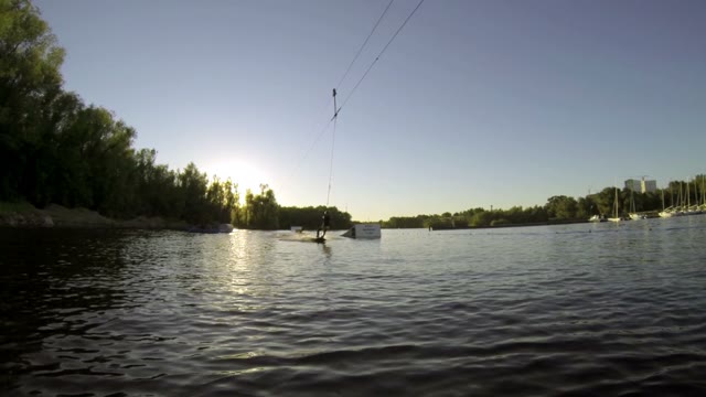 The Guy Doing Tricks On A Wakeboard In Slow Motion On The Lake