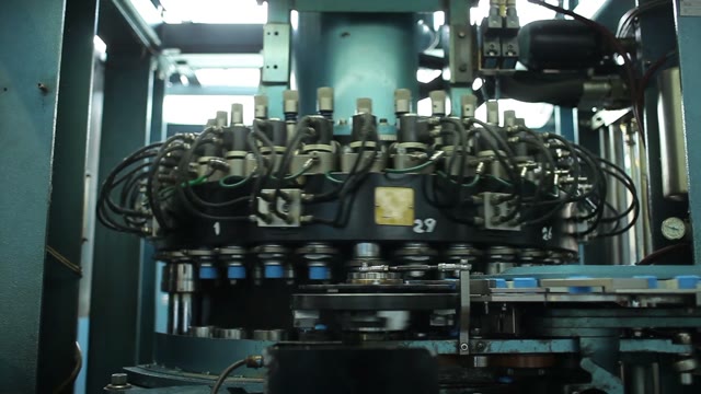 Rotating Machine. Conveyor. Production Of Plastic Bottle Caps.